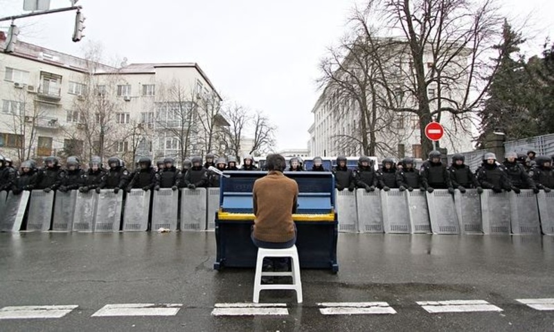 That’s me in the picture: Markiyan Matsekh plays the piano for riot police in Kiev, 7 December 2013