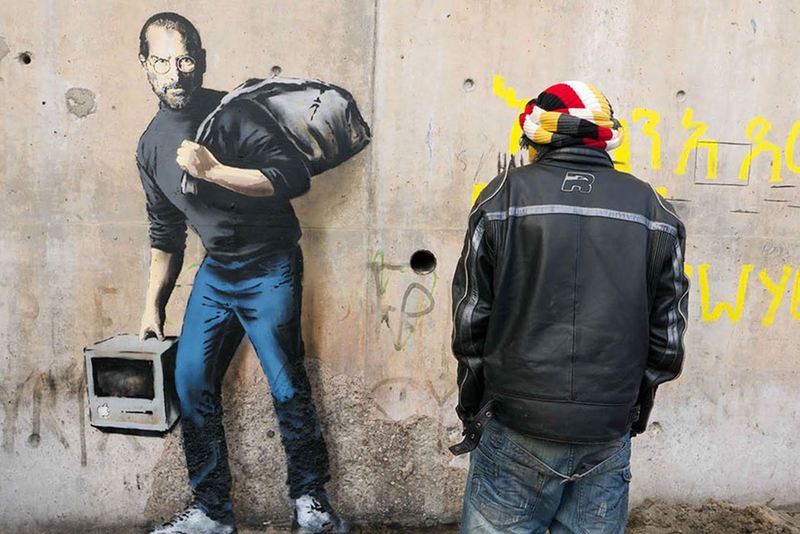Banksy’s striking new mural imagines Steve Jobs as a Syrian refugee
